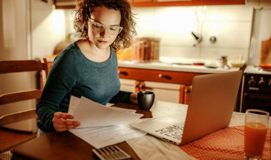 Woman researching the difference between a personal loan and a payday loan.